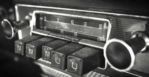 A close up of vintage car radio buttons